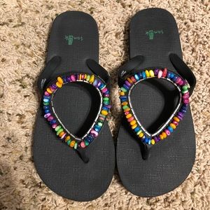 Multi-colored stone Sanuk Flip Flop